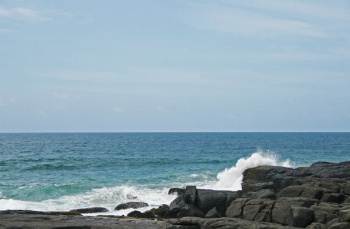 Sea Water Pounding Rocks