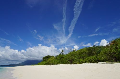 secluded beach clear blue sky quiet white sand beach