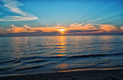 setting sun beach sea