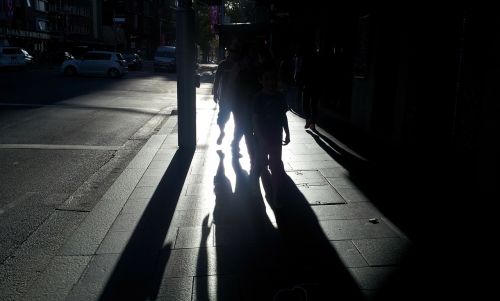 shadows people street