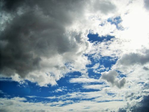 Shimmery Clouds In Blue Sky