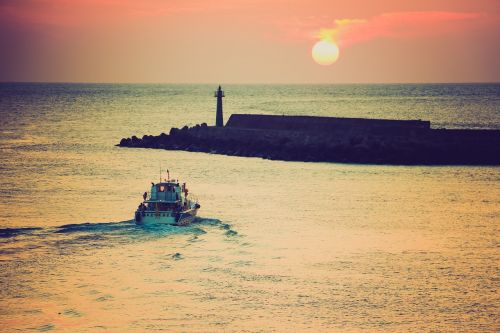 ship sunset island
