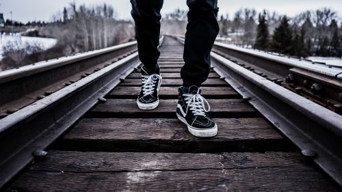 shoes walking railroad tracks