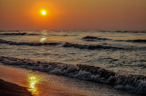 shore waves sunset