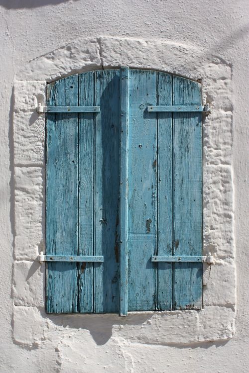 shutters blue white wall