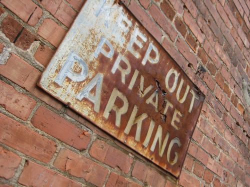 sign keep out brick