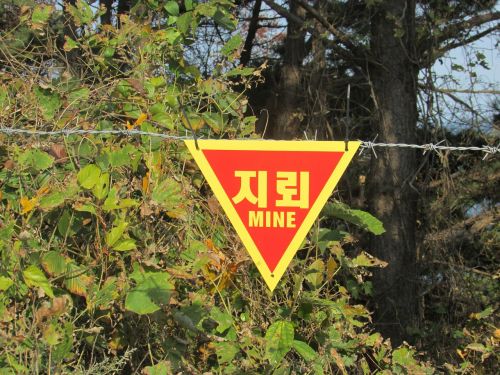 signs warning land mines