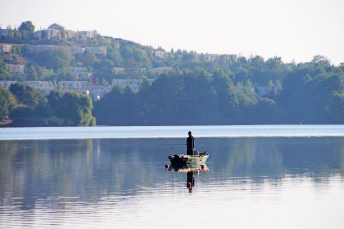 silent lake morning calm angler