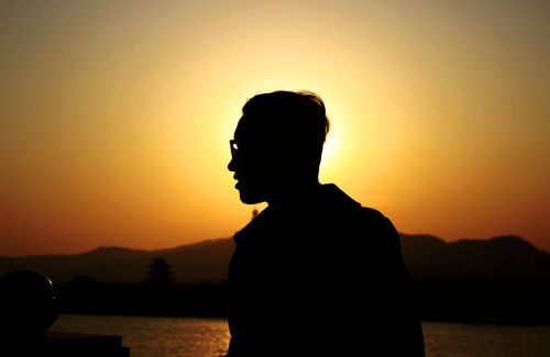 silhouette man sunset