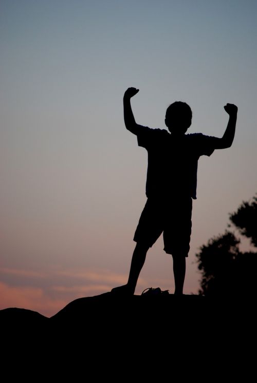 silhouette boy victory