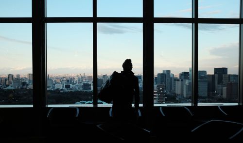 silhouette people building