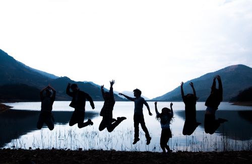 silhouette youth alpine lake