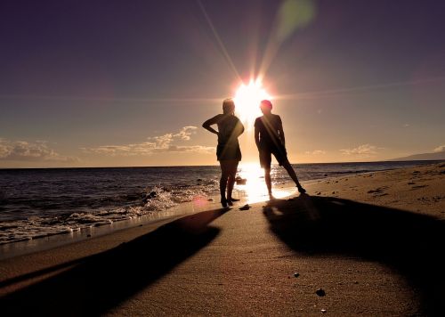 silhouettes beach people