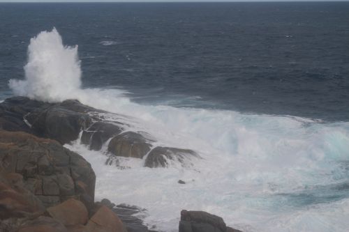Single Wave Burst On Rock