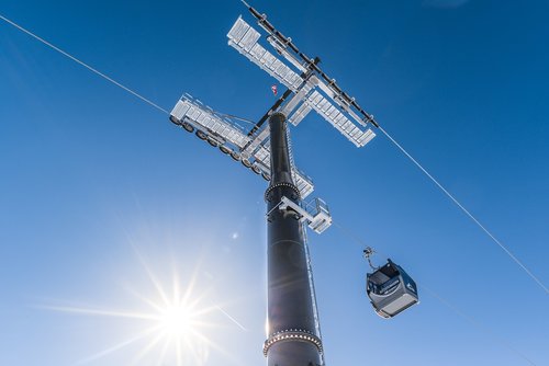 ski lift  sunstar  blue sky