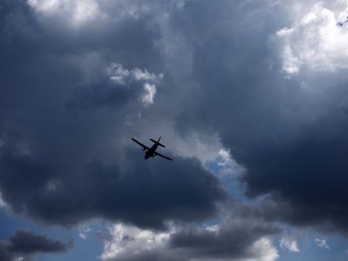 sky aircraft dark clouds