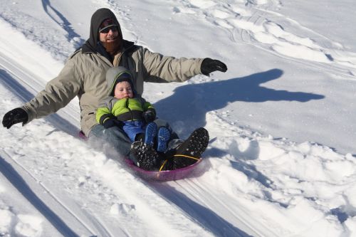 sledding winter father