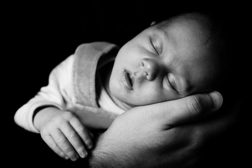 Sleeping Baby On A Hand