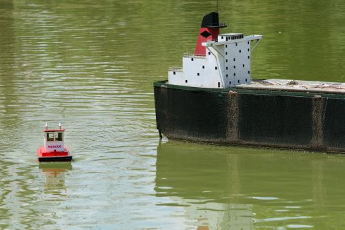 Small And Large Model Boats In Pond