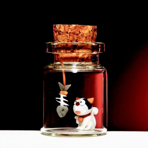 small sculpture glass jar