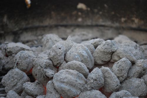smoldering charcoal briquettes barbecue
