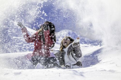snow girls playing