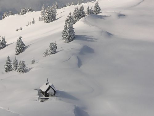 snow switzerland church