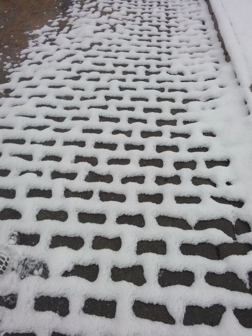 snow sidewalk stone