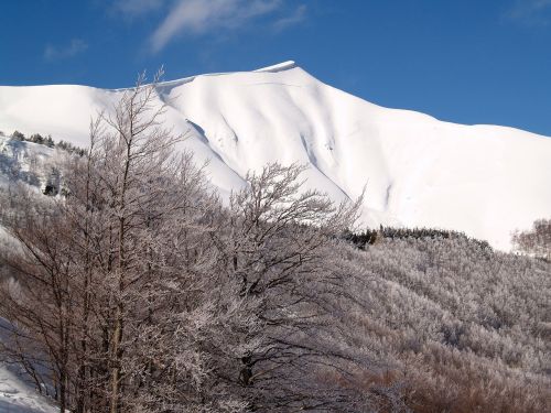 snow-capped peaks corno alle scale italy