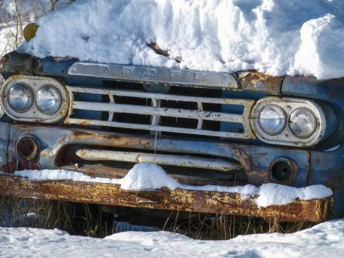 snow covered old truck