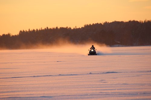 snowmobile  sunset  finnish