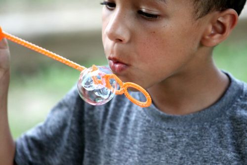 soap bubble boy blowing