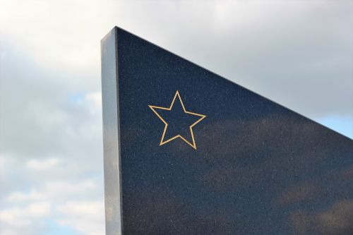 socialist monument gold star black marble