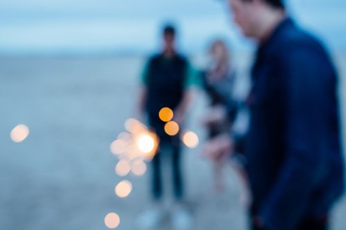 sparkler people beach