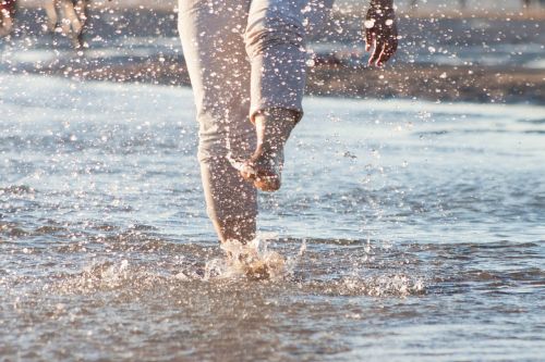 splashing feet ocean