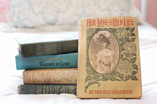stack of books  vintage books  women's novels