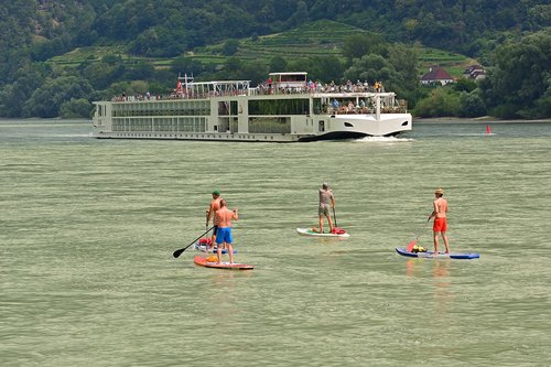 stand up paddle  danube  driving cruise ship