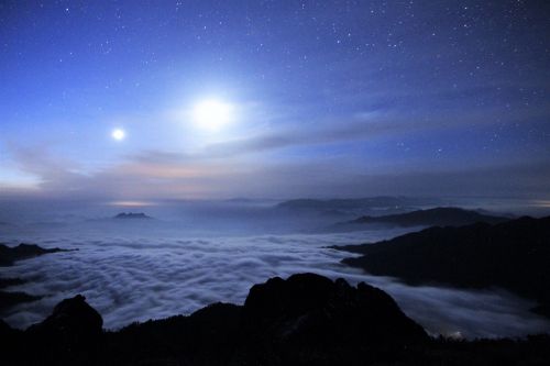 starry sky clouds four people with