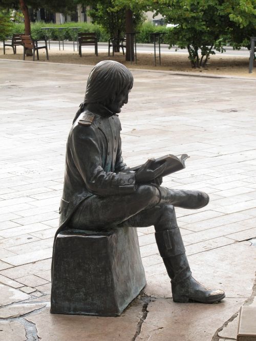 statue reading man
