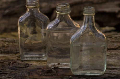 still life wooden board bottles