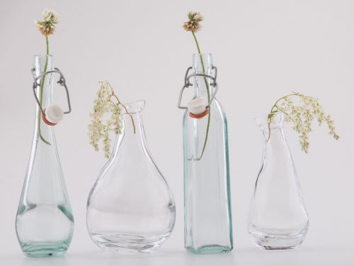 still life bottles flowers