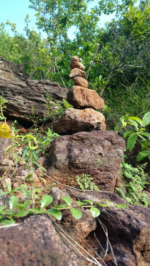 stone balancing hills tress