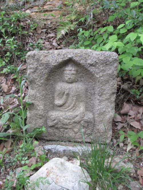 Stone Buddha On The Hiking Trail
