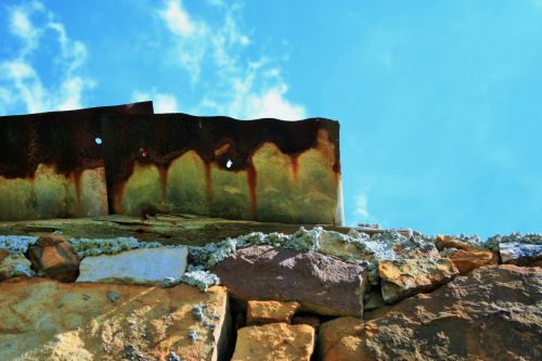 Stone Wall And Rusted Roof