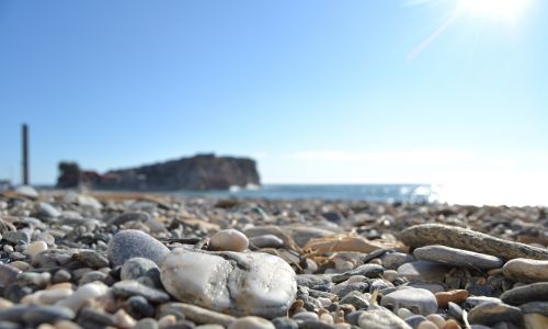 stones mediterranean shore beach