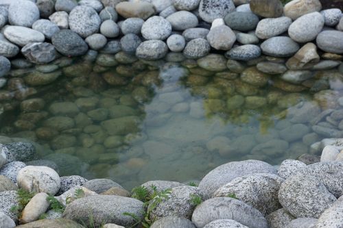 stones pond water