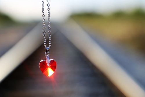 stop youth suicide  red heart medallion on railway  for all kids and teens