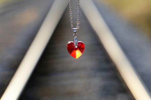stop youth suicide  red heart medallion on railway  for all kids and teens
