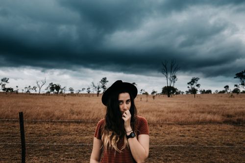 storm clouds countryside girl face