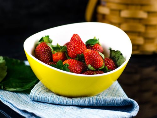 strawberry in yellow bowl strawberries red